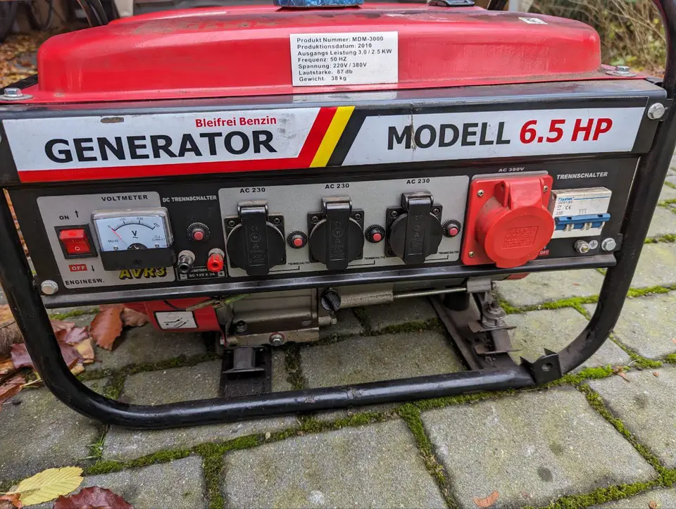 The control panel of a red portable electric generator